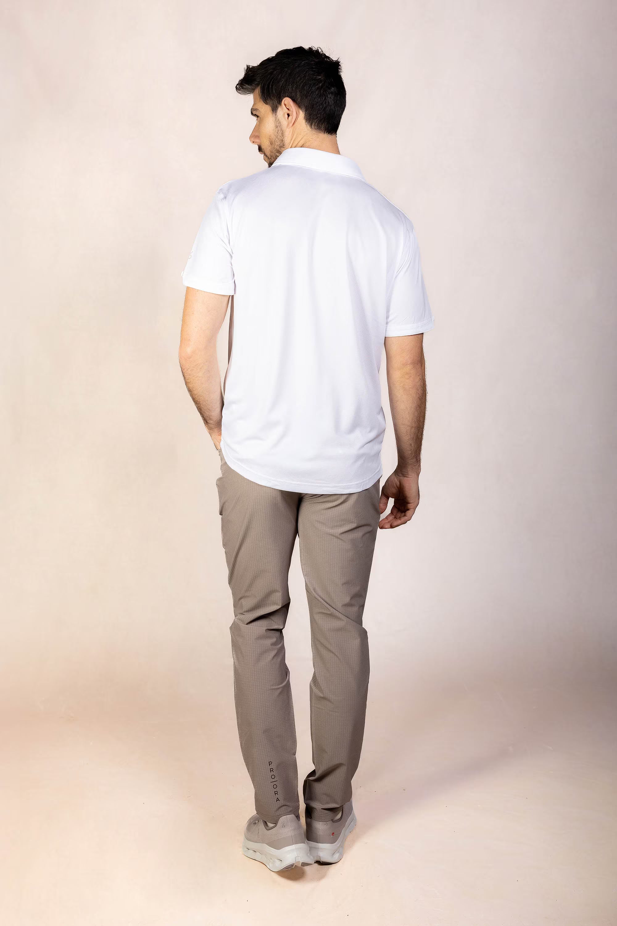 PRO | ORA men’s proformance polo shirt in White Onyx, studio product image, rear view