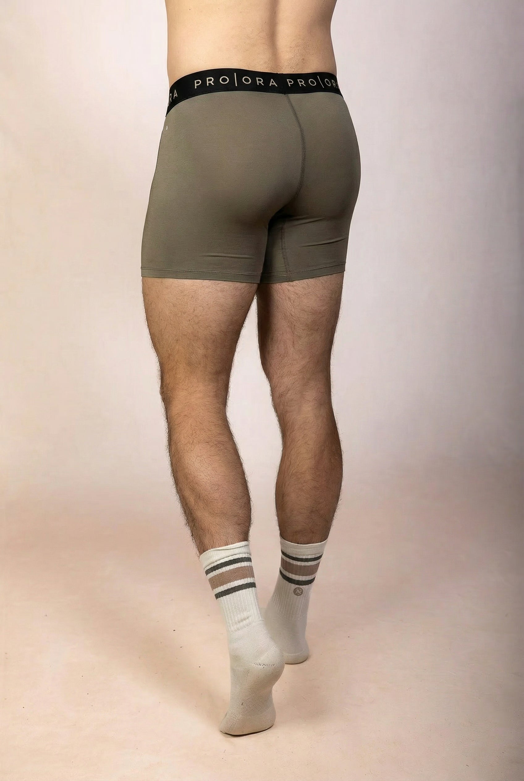 PRO | ORA men’s the precision brief in Olive Smoke, studio product image, rear view