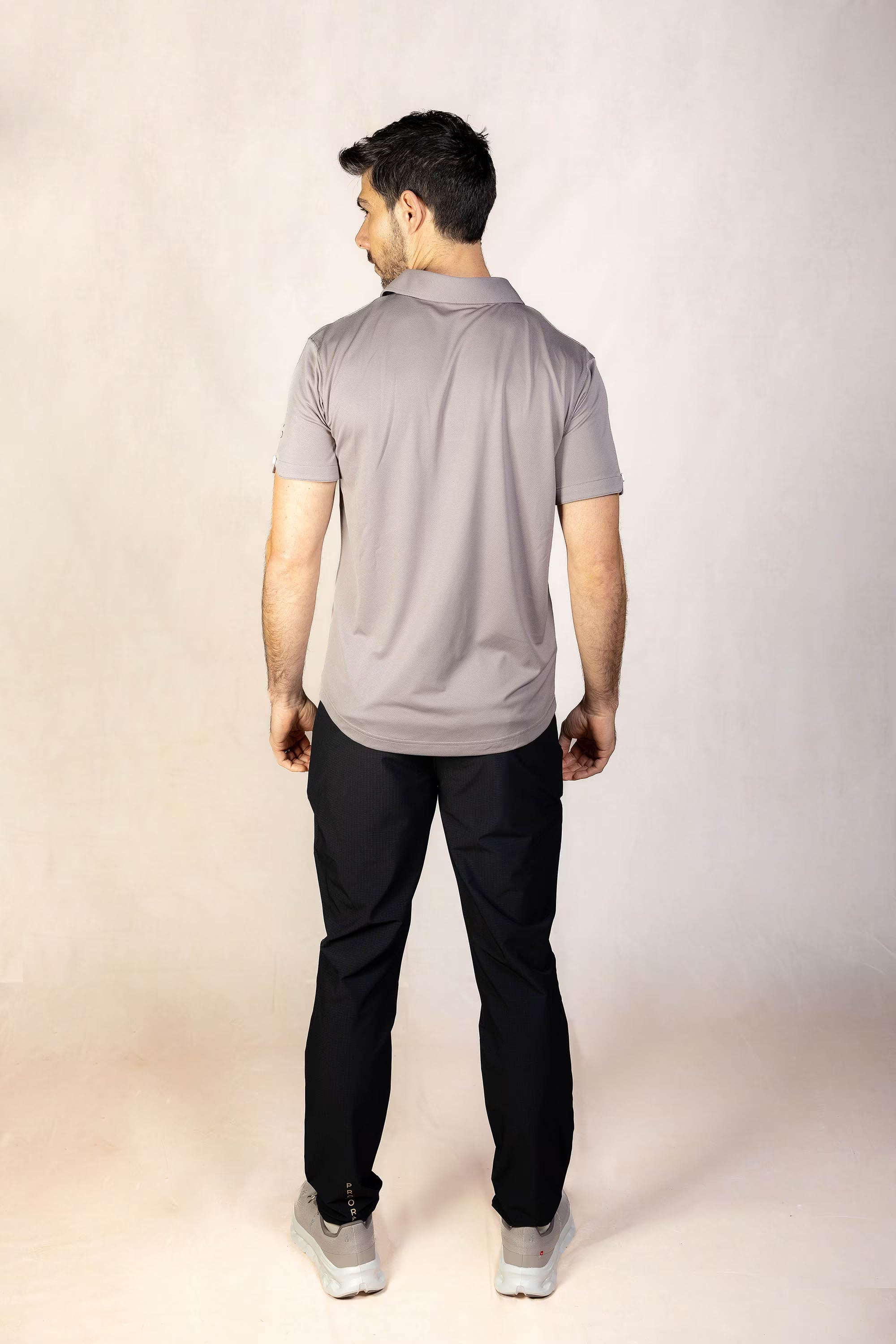 PRO | ORA men’s proformance polo shirt in Muted Clay, studio product image, rear view