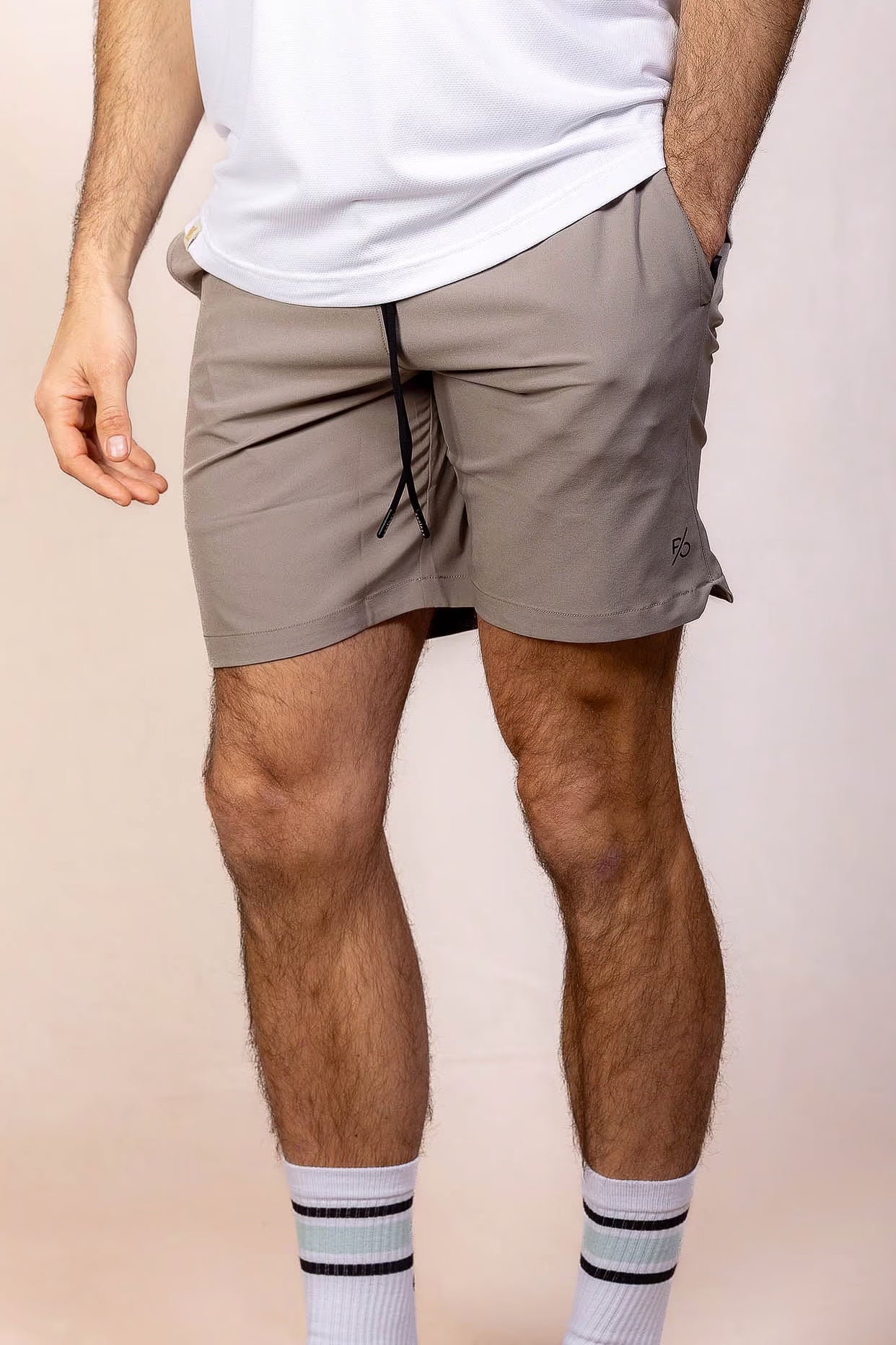 PRO | ORA men’s proformance short in Muted Clay, studio product image, front view