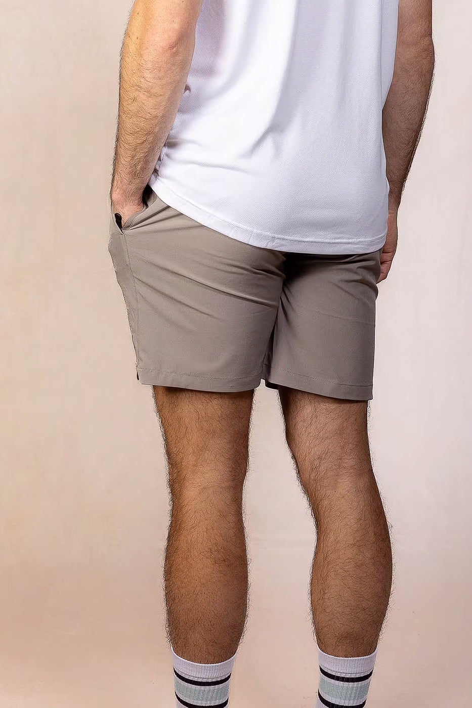 PRO | ORA men’s proformance short in Muted Clay, studio product image, rear view